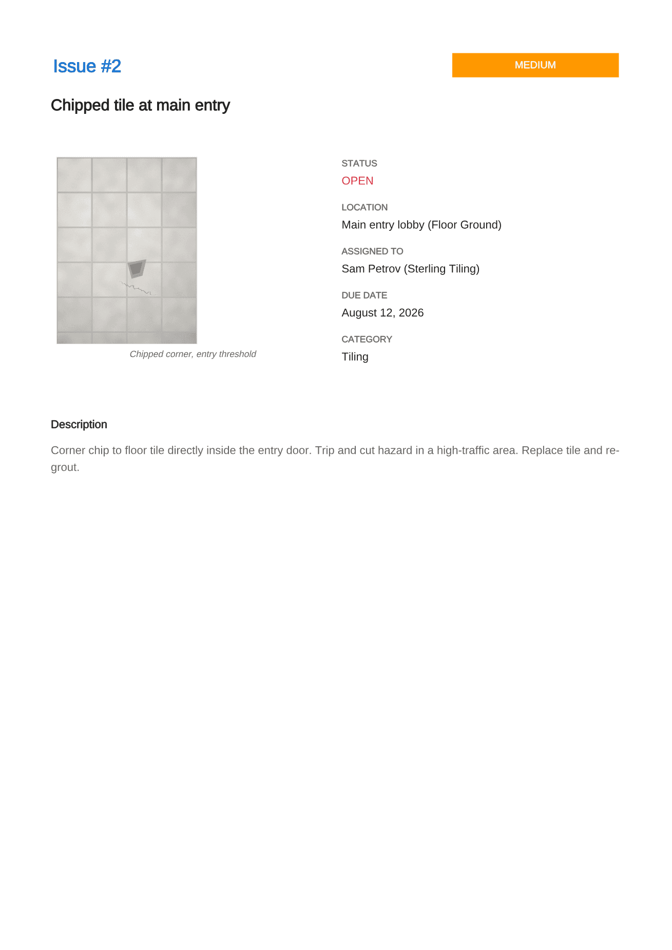 The second defect page of the sample report, a chipped tile at the main entry, laid out identically to the first defect page.